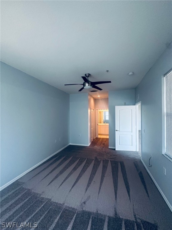 8550 Kingbird Loop, Unit 642 Estero, FL 33967 - Photo 12 of 14 a view of empty room with wooden floor and fan