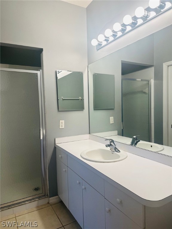 8550 Kingbird Loop, Unit 642 Estero, FL 33967 - Photo 13 of 14 a bathroom with a sink and a mirror