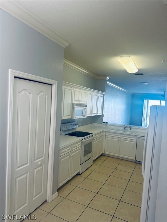 8550 Kingbird Loop, Unit 642 Estero, FL 33967 - Photo 2 of 14 a kitchen with a cabinets and white appliances