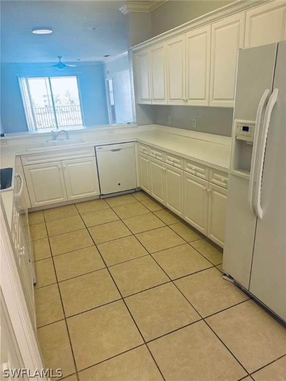 8550 Kingbird Loop, Unit 642 Estero, FL 33967 - Photo 3 of 14 a kitchen with a white cabinets and a refrigerator