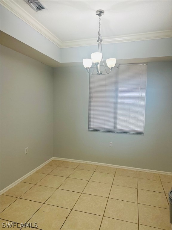 8550 Kingbird Loop, Unit 642 Estero, FL 33967 - Photo 4 of 14 a view of a room with wooden floor and chandelier