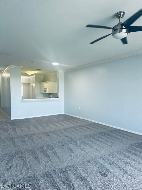 8550 Kingbird Loop, Unit 642 Estero, FL 33967 - Photo 5 of 14 an empty room with fan and windows