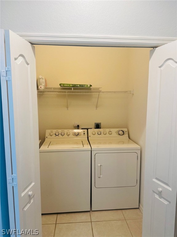 8550 Kingbird Loop, Unit 642 Estero, FL 33967 - Photo 7 of 14 a utility room with dryer and washer