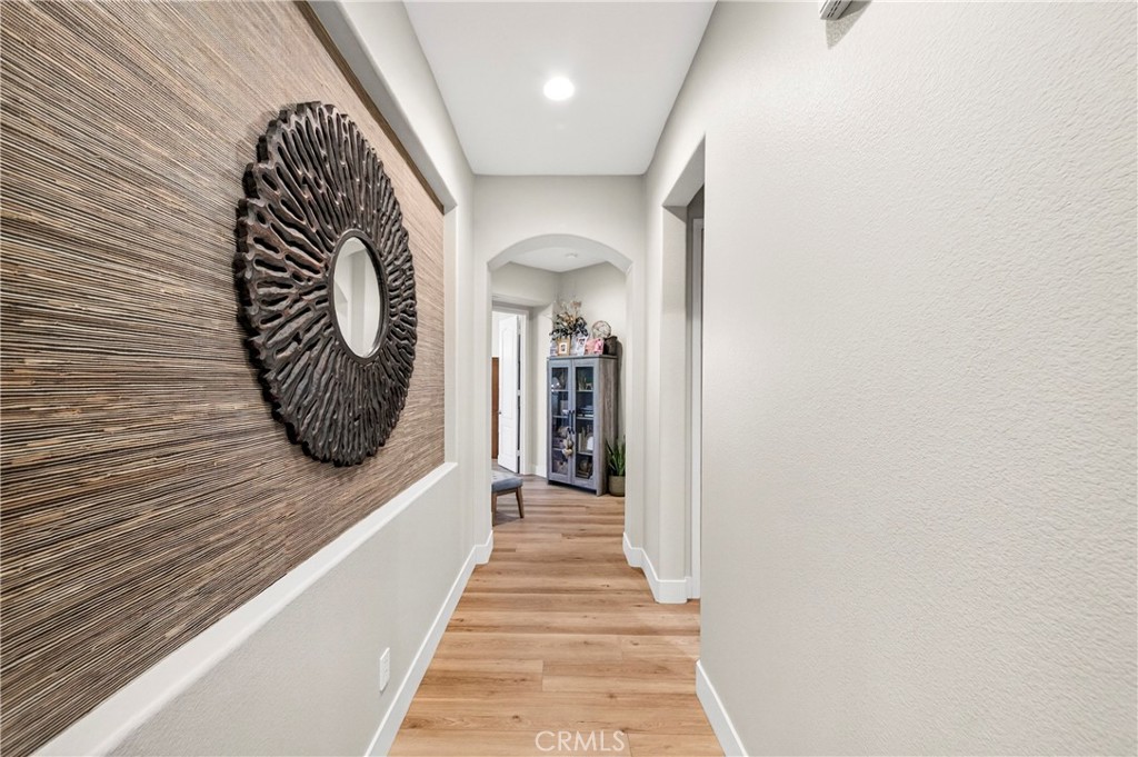 16375 Ory Circle Riverside, CA 92503 - Photo 20 of 51 a view of a hallway with wooden floor and a large window