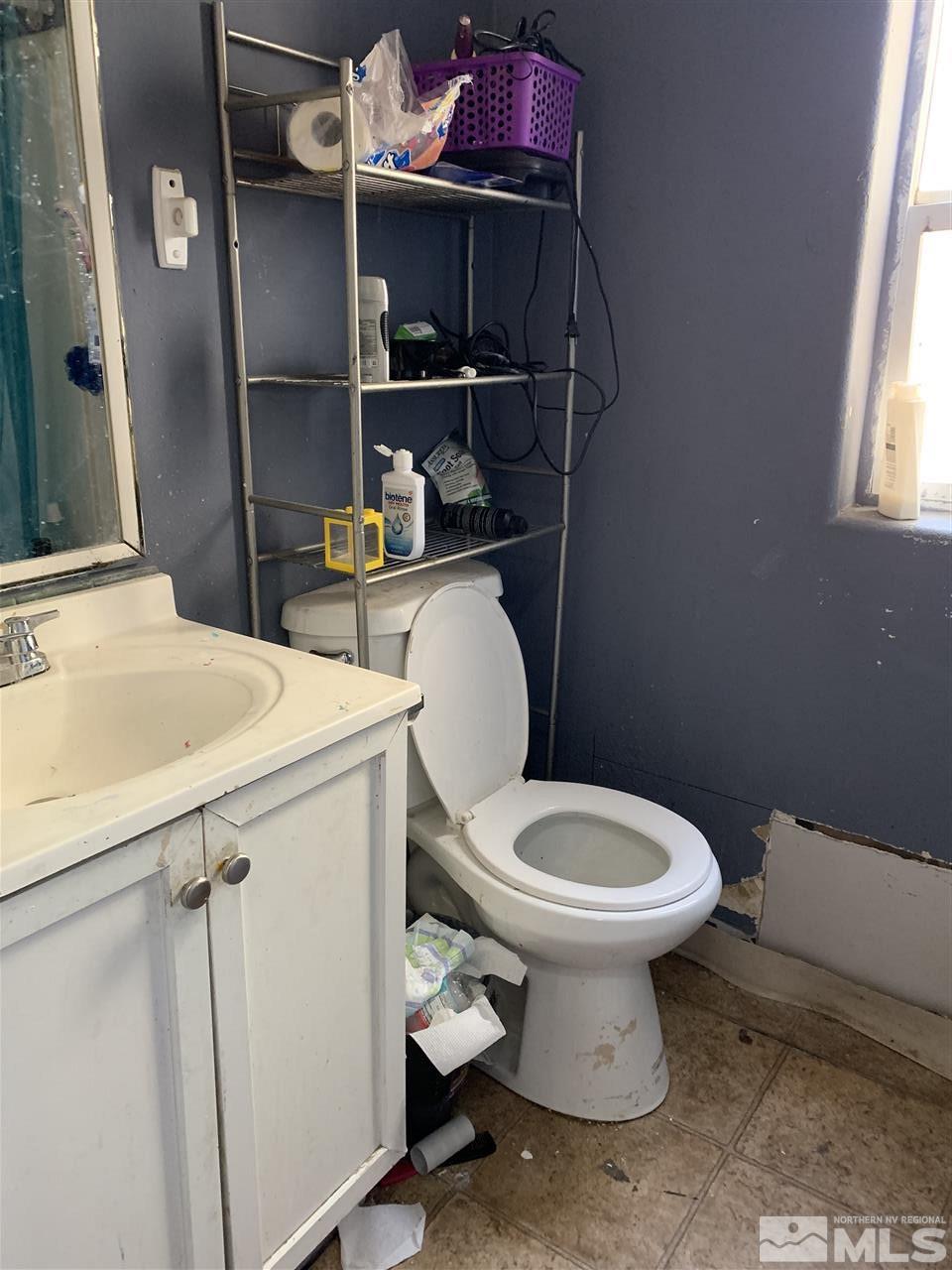 5421 West Ranger Road Reno, NV 89506 - Photo 5 of 6 a bathroom with a toilet and a sink
