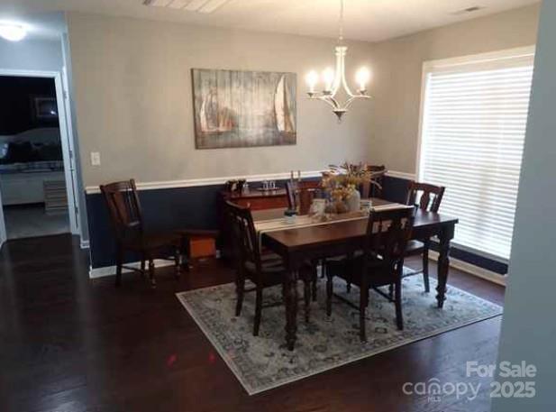 155 Lumber River Road Fletcher, NC 28732 - Photo 2 of 4 a view of a dining room with furniture and wooden floor