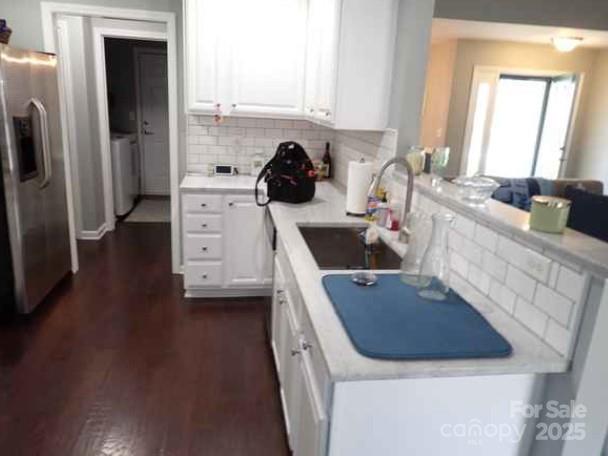 155 Lumber River Road Fletcher, NC 28732 - Photo 3 of 4 a kitchen with a sink dishwasher a refrigerator and cabinets