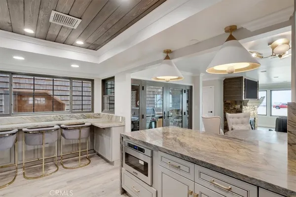 a kitchen with stainless steel appliances granite countertop a sink and cabinets