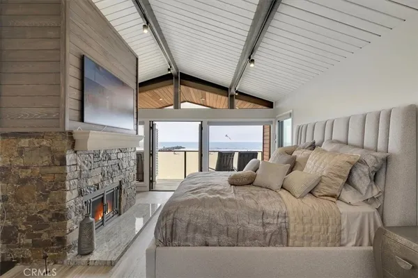 a bedroom with a bed and a fireplace