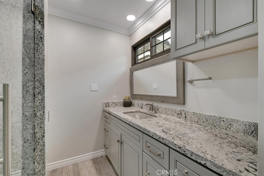 2808 West Oceanfront Newport Beach, CA 92663 - Photo 22 of 31 a bathroom with a sink and a mirror