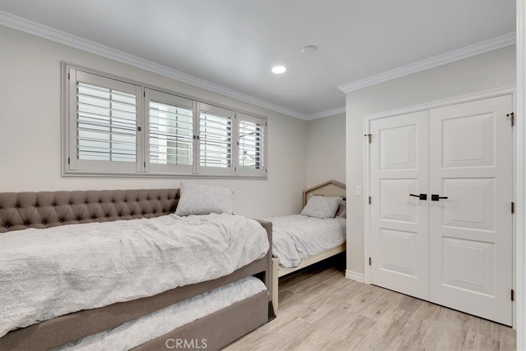 2808 West Oceanfront Newport Beach, CA 92663 - Photo 23 of 31 a bedroom with a bed and a window