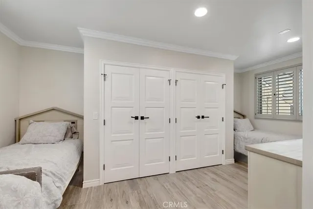 a bedroom with a bed and a sink