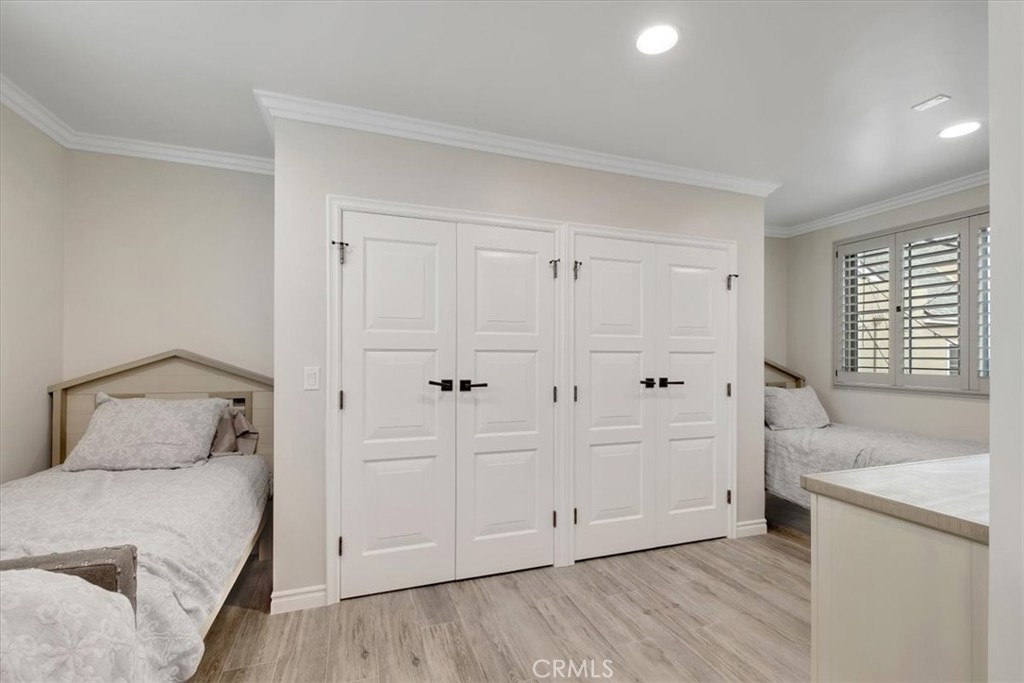 2808 West Oceanfront Newport Beach, CA 92663 - Photo 24 of 31 a bedroom with a bed and a sink