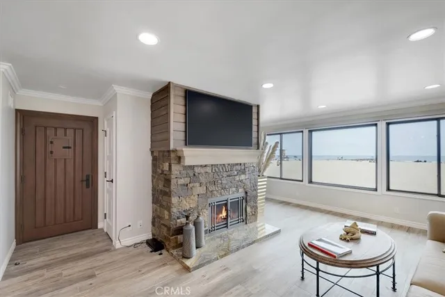 a living room with fireplace furniture and a flat screen tv