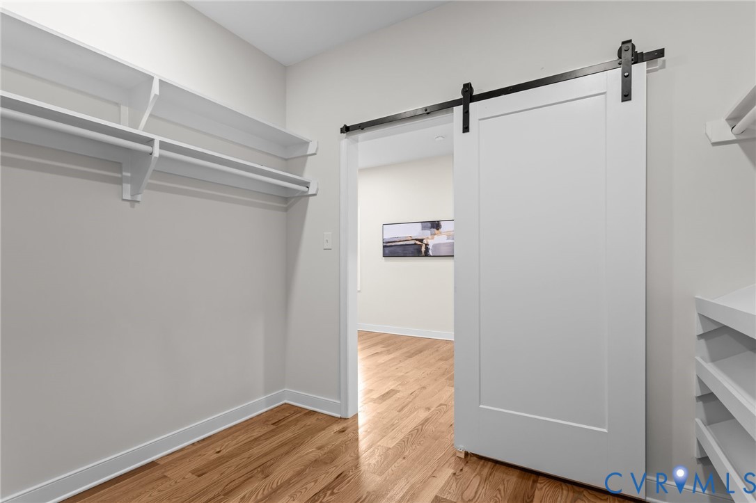 1218 Old Hundred Road Midlothian, VA 23114 - Photo 26 of 37 Walk in closet featuring light wood-style floors a