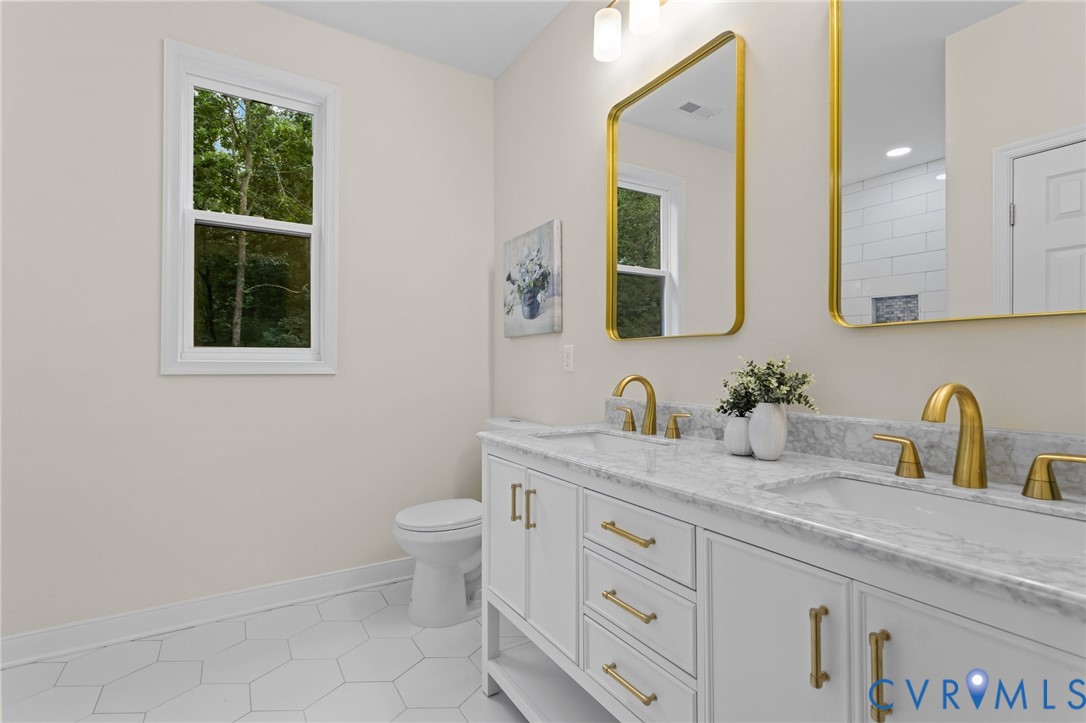 1218 Old Hundred Road Midlothian, VA 23114 - Photo 28 of 37 Bathroom featuring double vanity and light tile pa