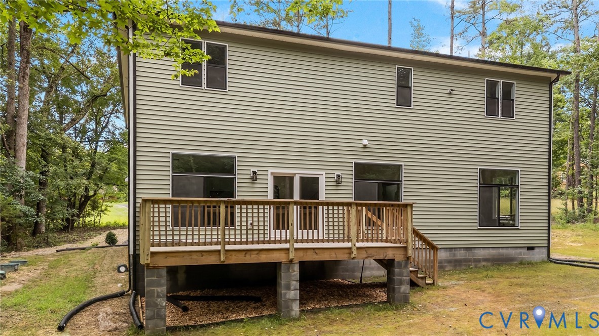1218 Old Hundred Road Midlothian, VA 23114 - Photo 36 of 37 Back of property with a wooden deck, a lawn, and c