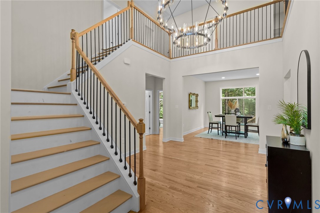 1218 Old Hundred Road Midlothian, VA 23114 - Photo 10 of 37 Stairs with wood finished floors, a high ceiling,