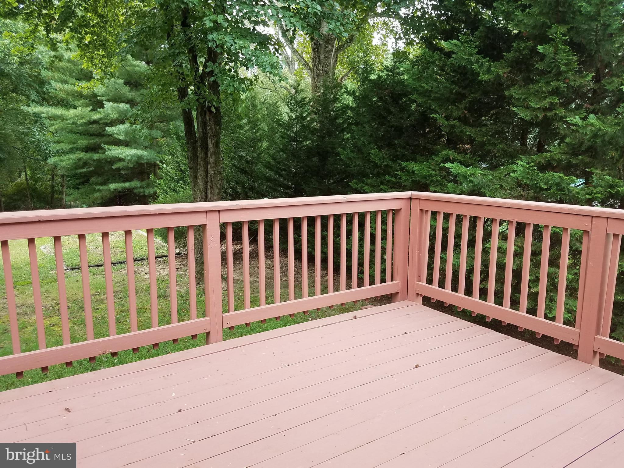 8720 Crest Road Severn, MD 21144 - Photo 19 of 26 Large deck overlooks spacious yard