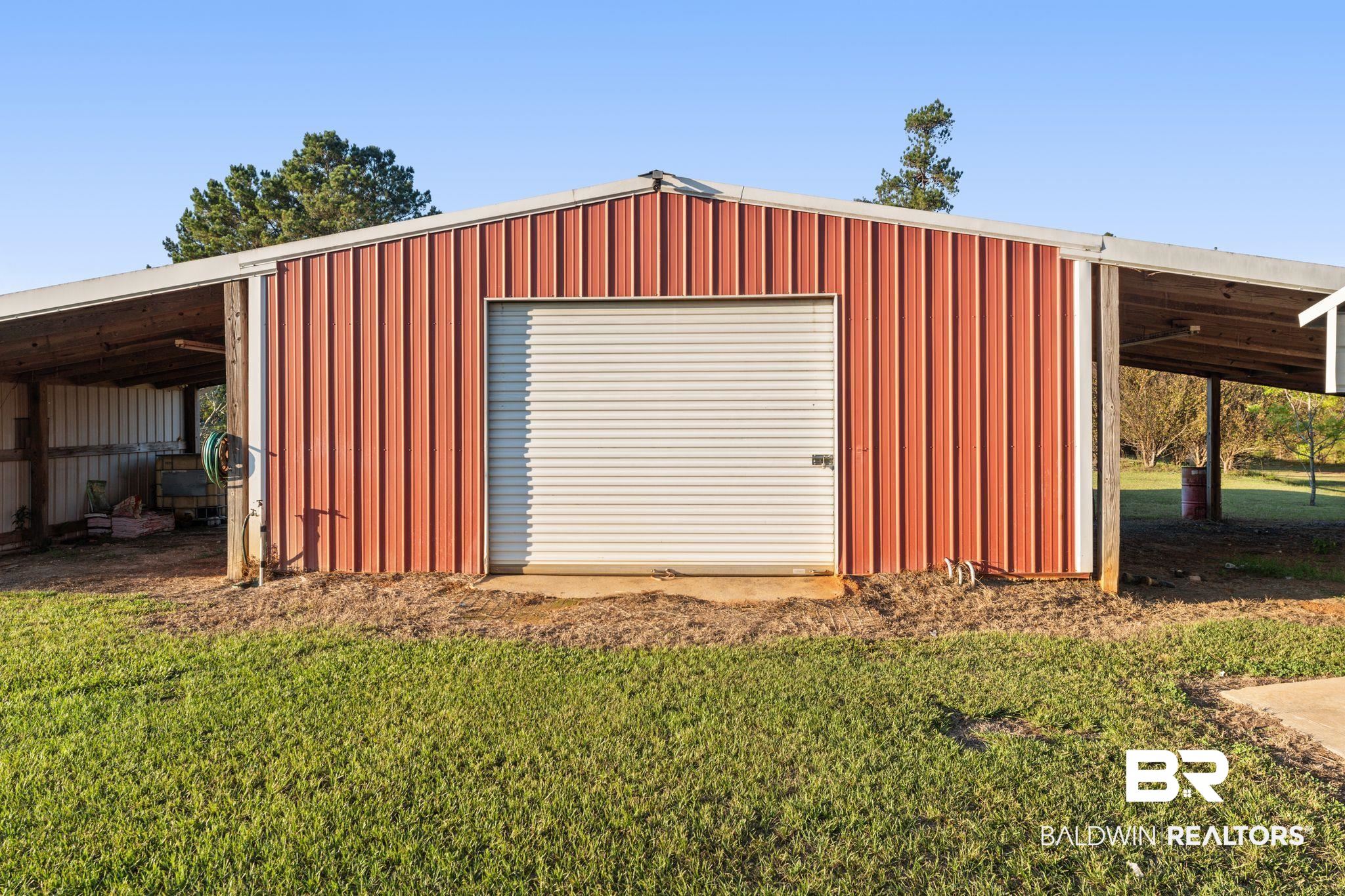 888 Mobile Cut-Off Road St. Stephens, AL 36569 - Photo 34 of 54 Garage featuring a detached garage
