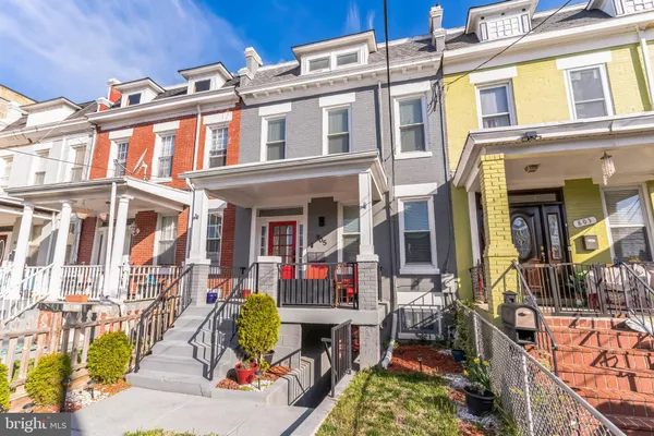 a front view of a house with a fence