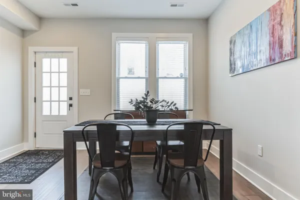 a view of a dining room with furniture and window