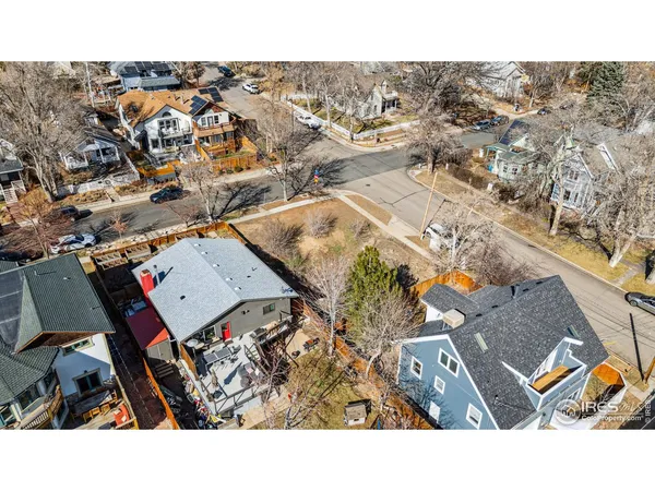a aerial view of a house with a yard
