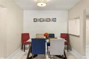 a view of a workspace with furniture