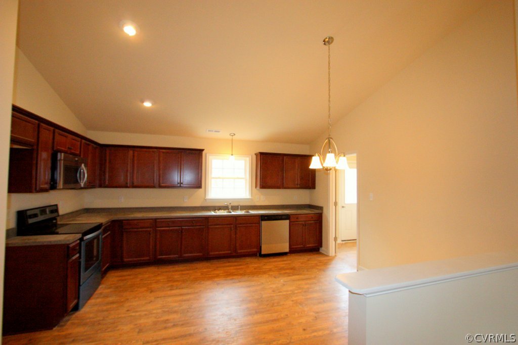16 Winding Ridge Way Bumpass, VA 23024 - Photo 10 of 20 a kitchen with stainless steel appliances granite countertop a sink and a stove top oven