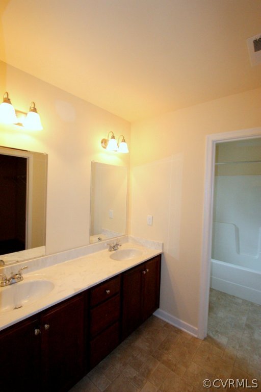 16 Winding Ridge Way Bumpass, VA 23024 - Photo 14 of 20 a bathroom with a double vanity sink and mirror