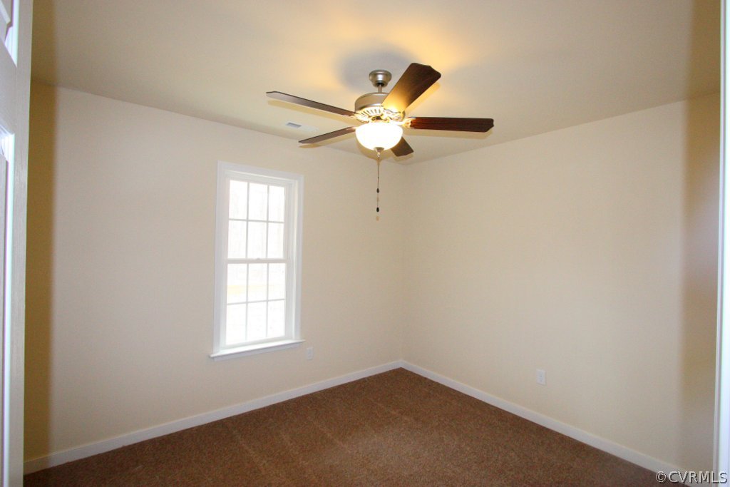 16 Winding Ridge Way Bumpass, VA 23024 - Photo 18 of 20 an empty room with a window and a fan