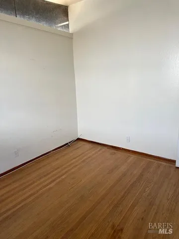 a view of gallery with wooden floor