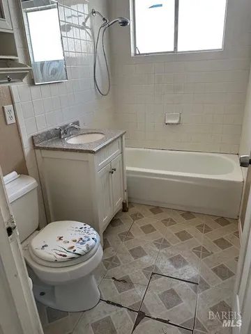 a bathroom with a toilet and a sink