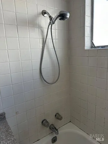 a view of a room with wooden floor and cabinet