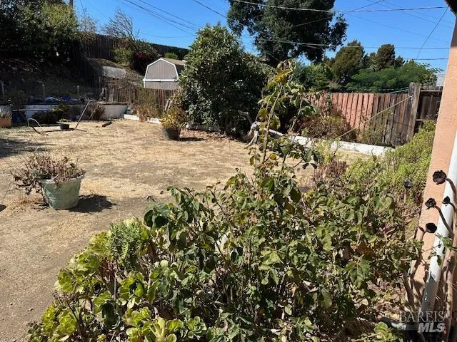 a view of a house with a yard covered in snow