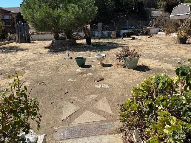 a view of a backyard of the house