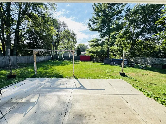 a view of a park with large trees