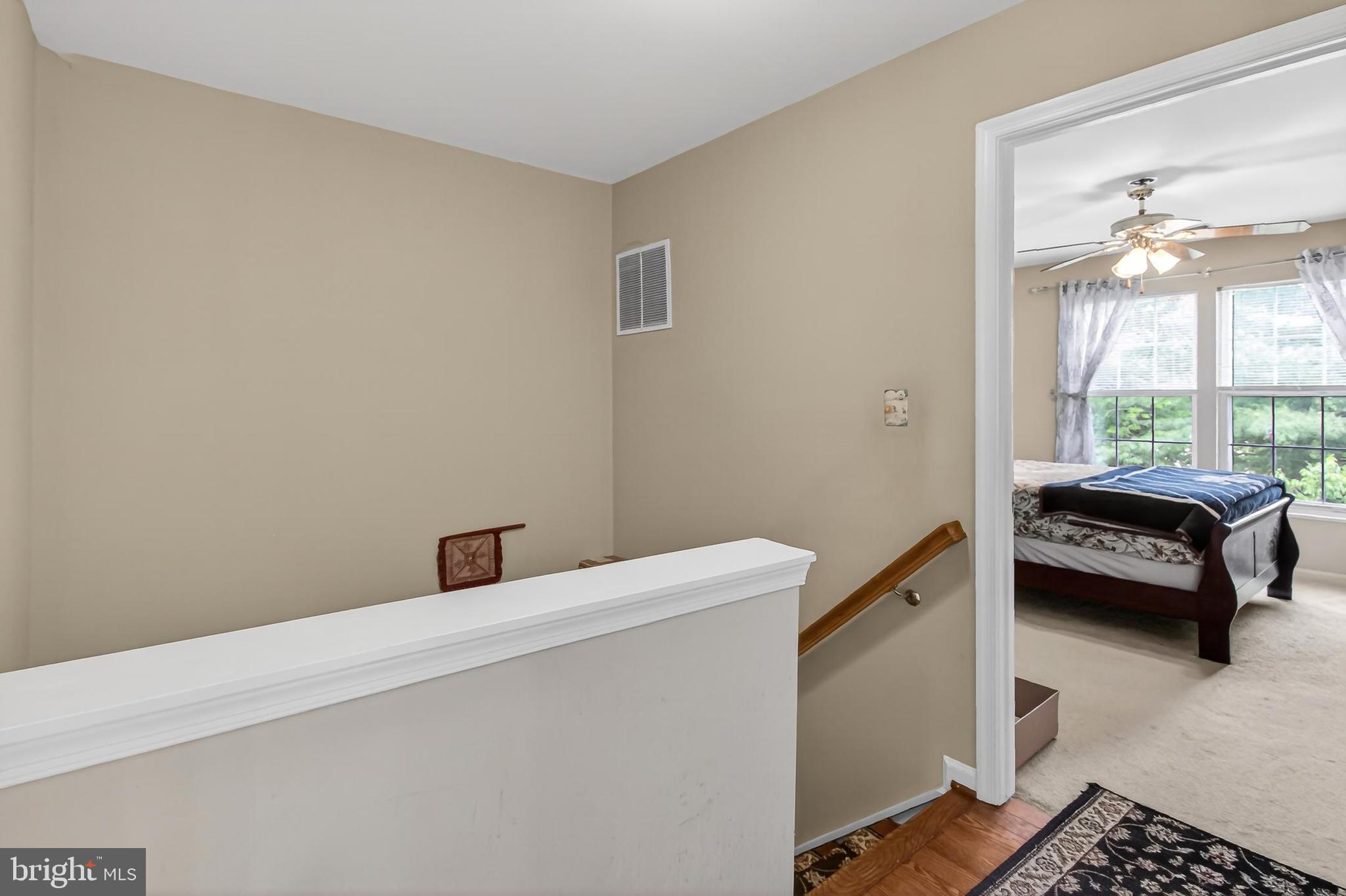 8602 Walcott Court Manassas, VA 20111 - Photo 20 of 53 a bedroom with a bed and a window