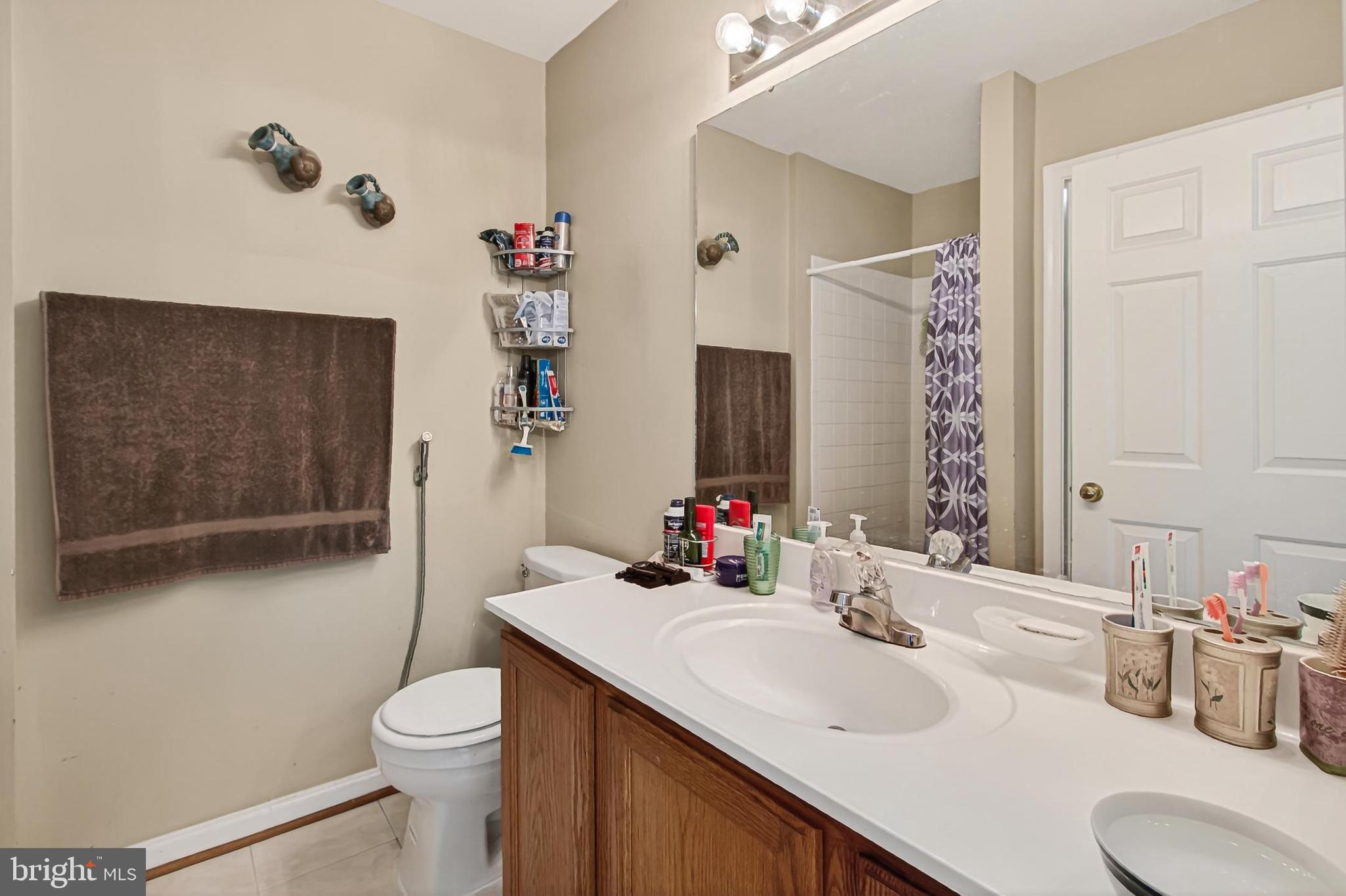 8602 Walcott Court Manassas, VA 20111 - Photo 25 of 53 a bathroom with a sink toilet and shower