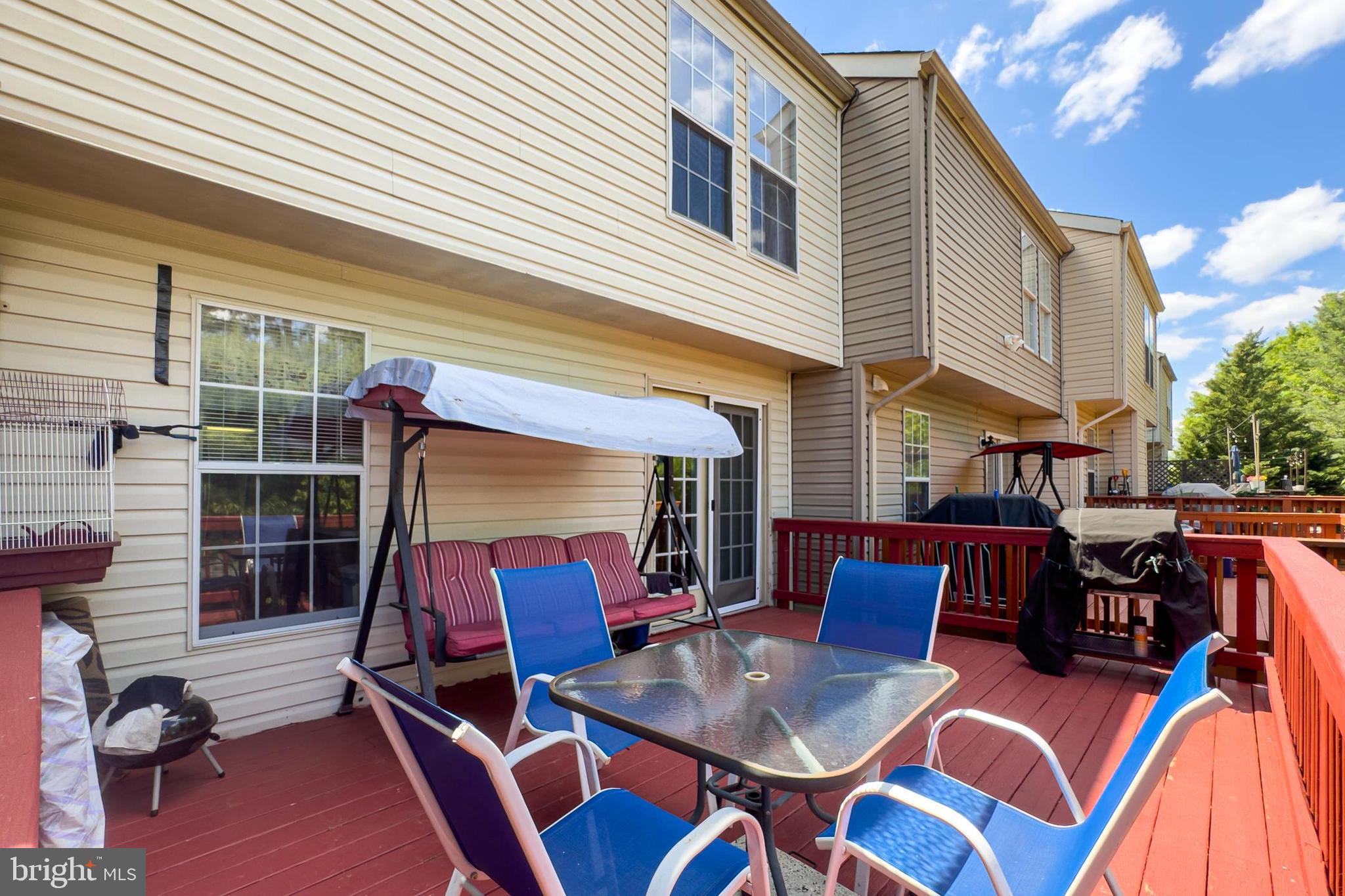 8602 Walcott Court Manassas, VA 20111 - Photo 41 of 53 a view of a patio with a table and chairs