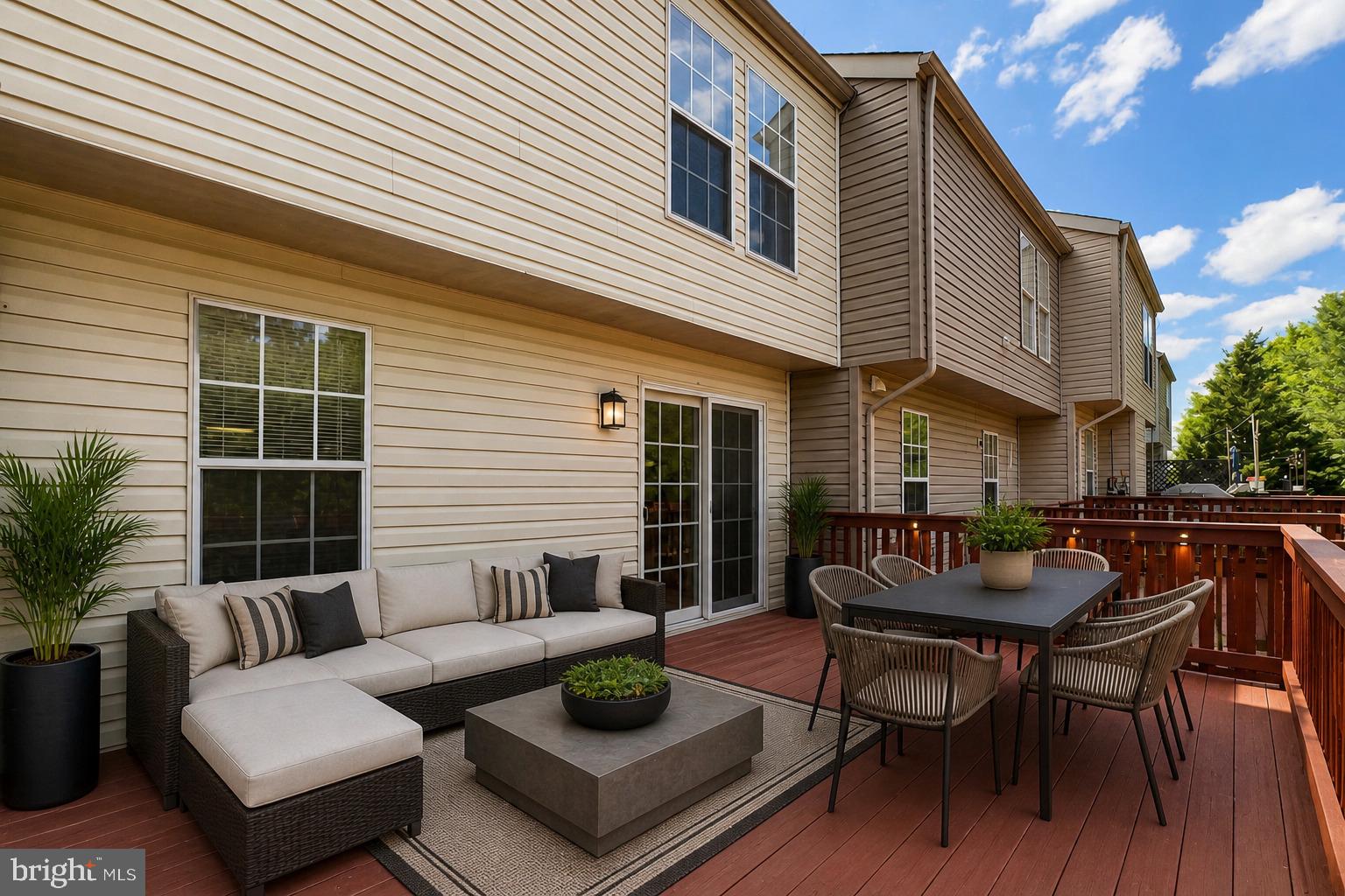 8602 Walcott Court Manassas, VA 20111 - Photo 42 of 53 a view of a patio with couches table and chairs and potted plants