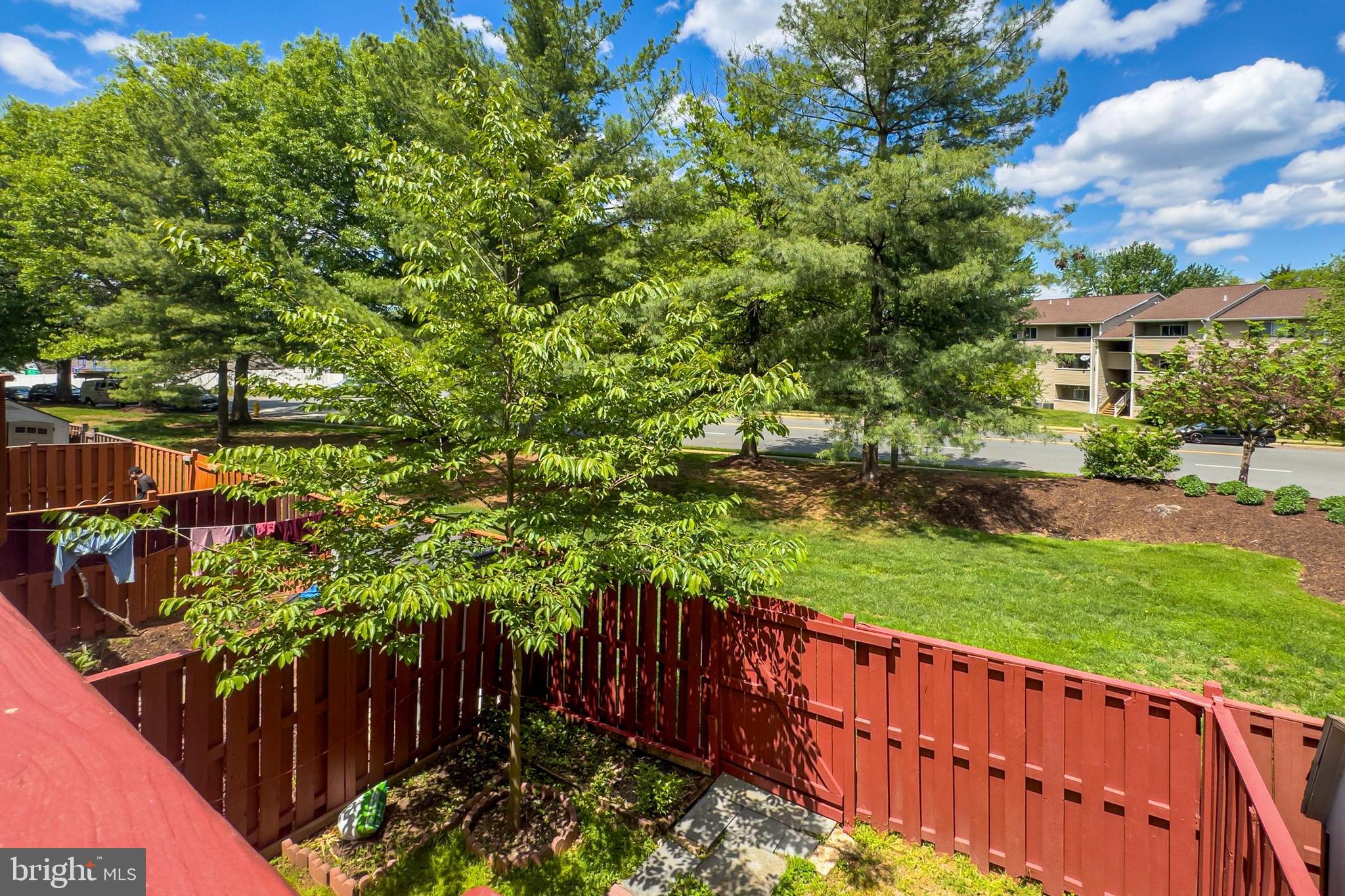8602 Walcott Court Manassas, VA 20111 - Photo 43 of 53 a view of a backyard with wooden fence