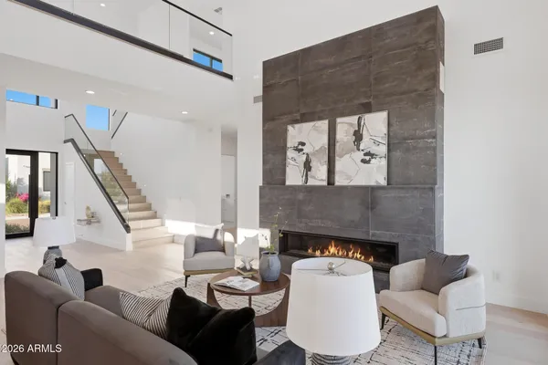 a living room with furniture and a fireplace