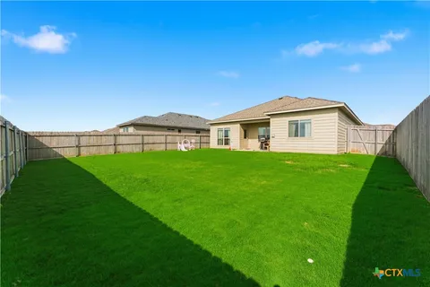 a view of a house with a big yard