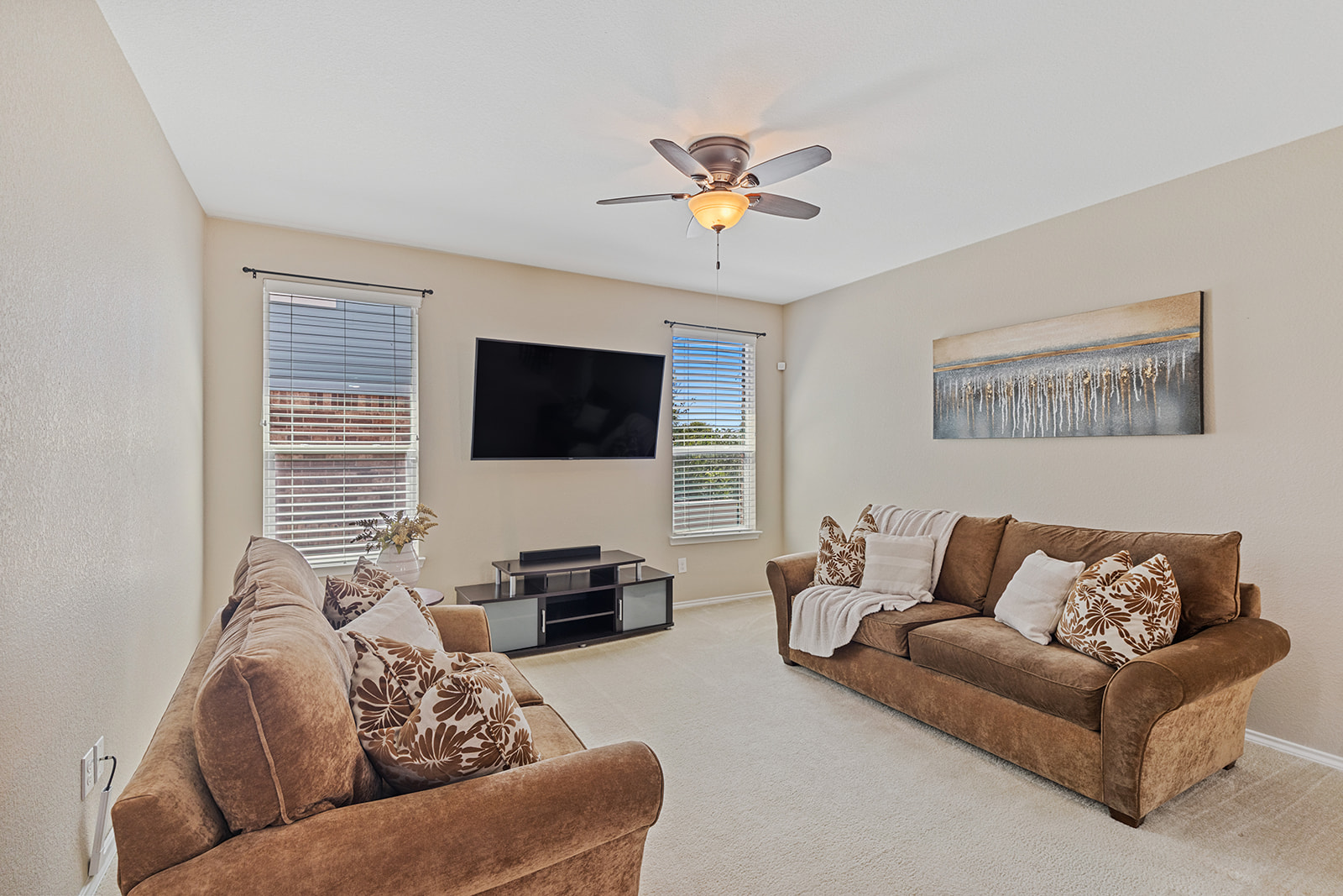 437 Sheepshank Drive Georgetown, TX 78633 - Photo 3 of 22 An inviting family room with ample natural lighting and flexibility to arrange large furnishings pieces of various shapes and sizes.