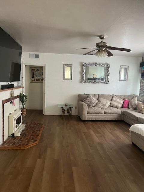 165 East Linden Avenue Reedley, CA 93654 - Photo 11 of 19 a living room with furniture and a flat screen tv