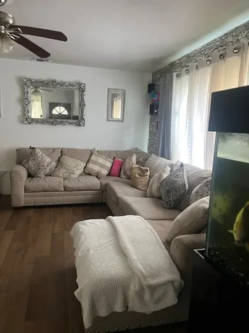 a living room with furniture and a window