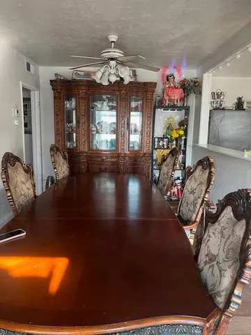 a view of a room with furniture and chandelier
