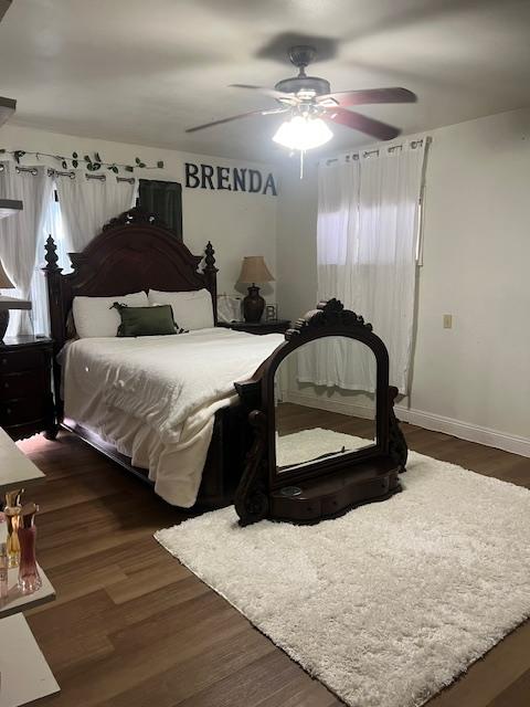 165 East Linden Avenue Reedley, CA 93654 - Photo 15 of 19 a bedroom with a bed and a mirror