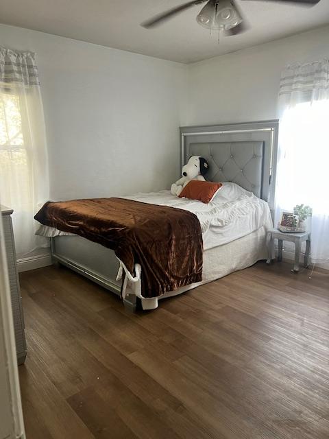 165 East Linden Avenue Reedley, CA 93654 - Photo 18 of 19 a bed sitting in a bedroom next to a window